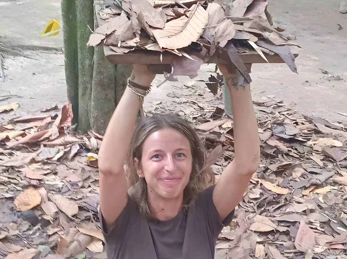 Hands-on coconut candy workshop stop on the Cu Chi Tunnels and Mekong Delta tour